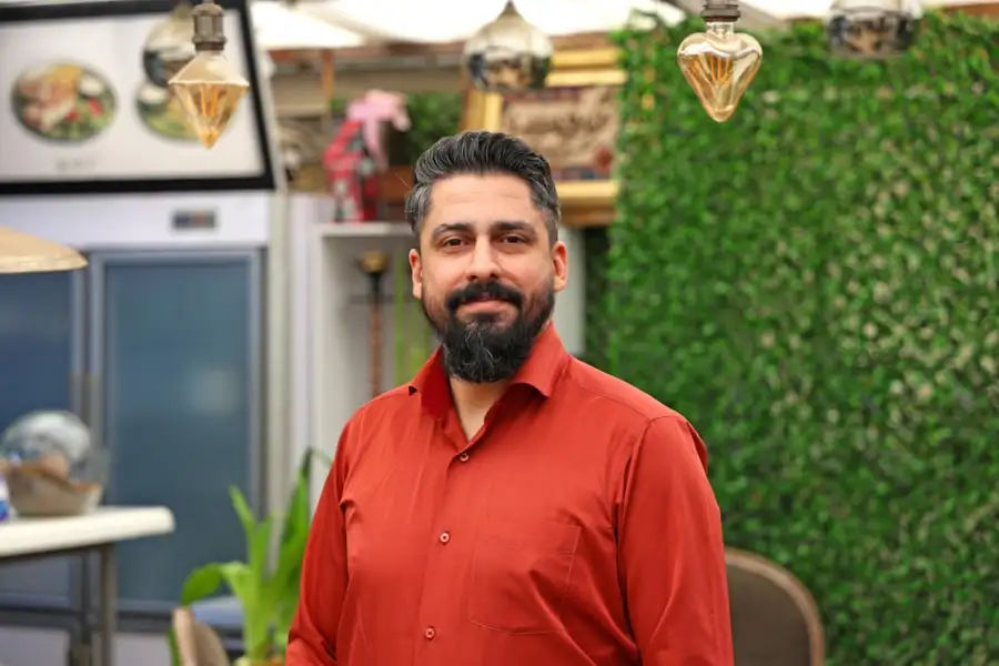 Small business owner standing in their shop