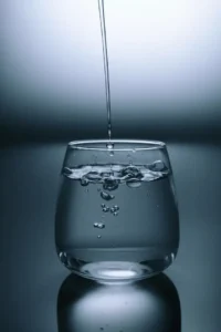 A glass being filled with clean drinking water, representing a clean-water venture