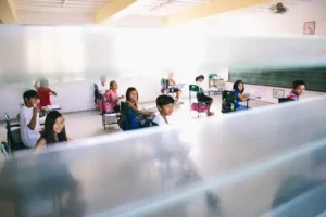 Children reading in a classroom representing a literacy programme