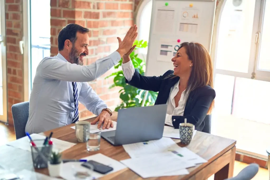 Business team celebrating a success in the office